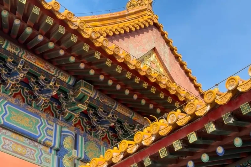 Painted eaves and glazed roof brackets seen from below